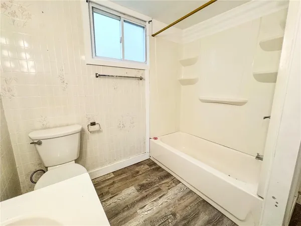 a bathroom with a sink toilet and vanity