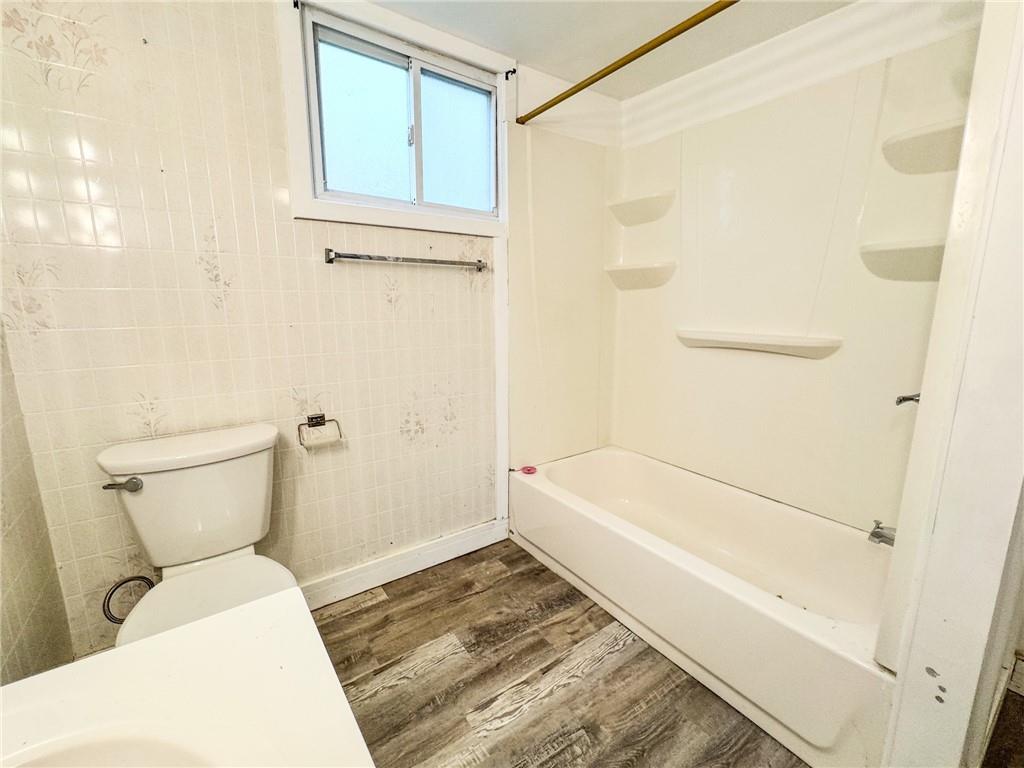 604 Center Avenue Butler, PA 16001 - Photo 16 of 17 a bathroom with a sink a toilet and bathtub