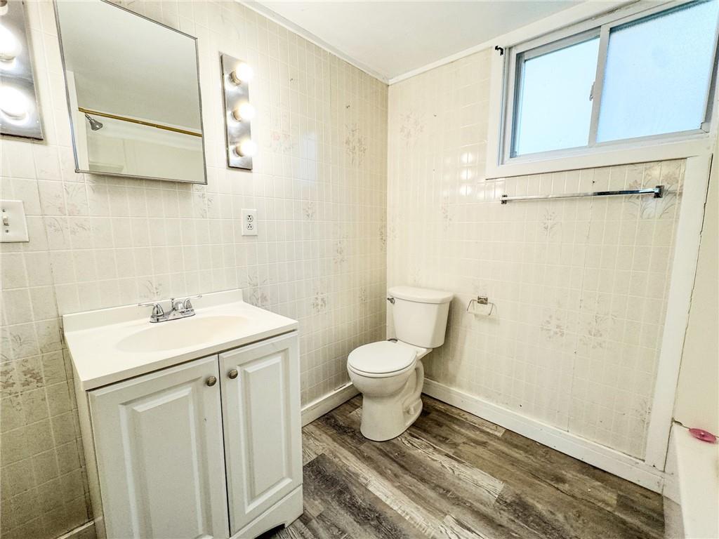 604 Center Avenue Butler, PA 16001 - Photo 17 of 17 a bathroom with a sink toilet and vanity