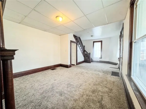 a view of a room with a staircase