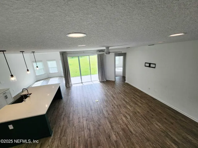a kitchen with a stove and a refrigerator
