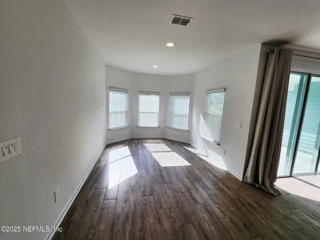 a view of a room with a ceiling fan