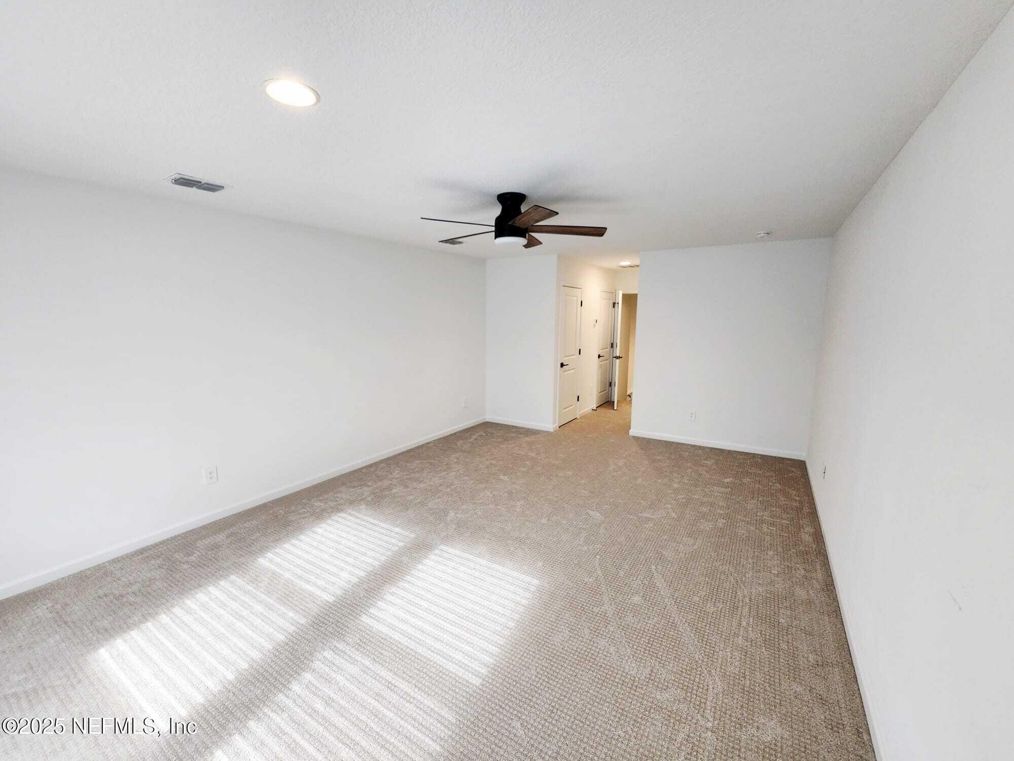 577 Archstone Way St. Augustine, FL 32092 - Photo 18 of 45 a view of a big room with carpet