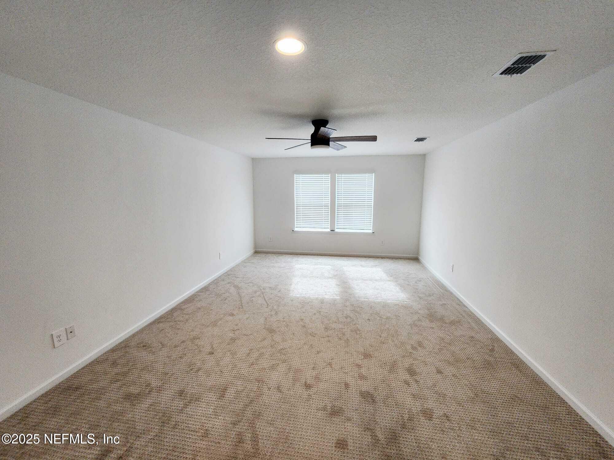 577 Archstone Way St. Augustine, FL 32092 - Photo 22 of 45 an empty room with windows