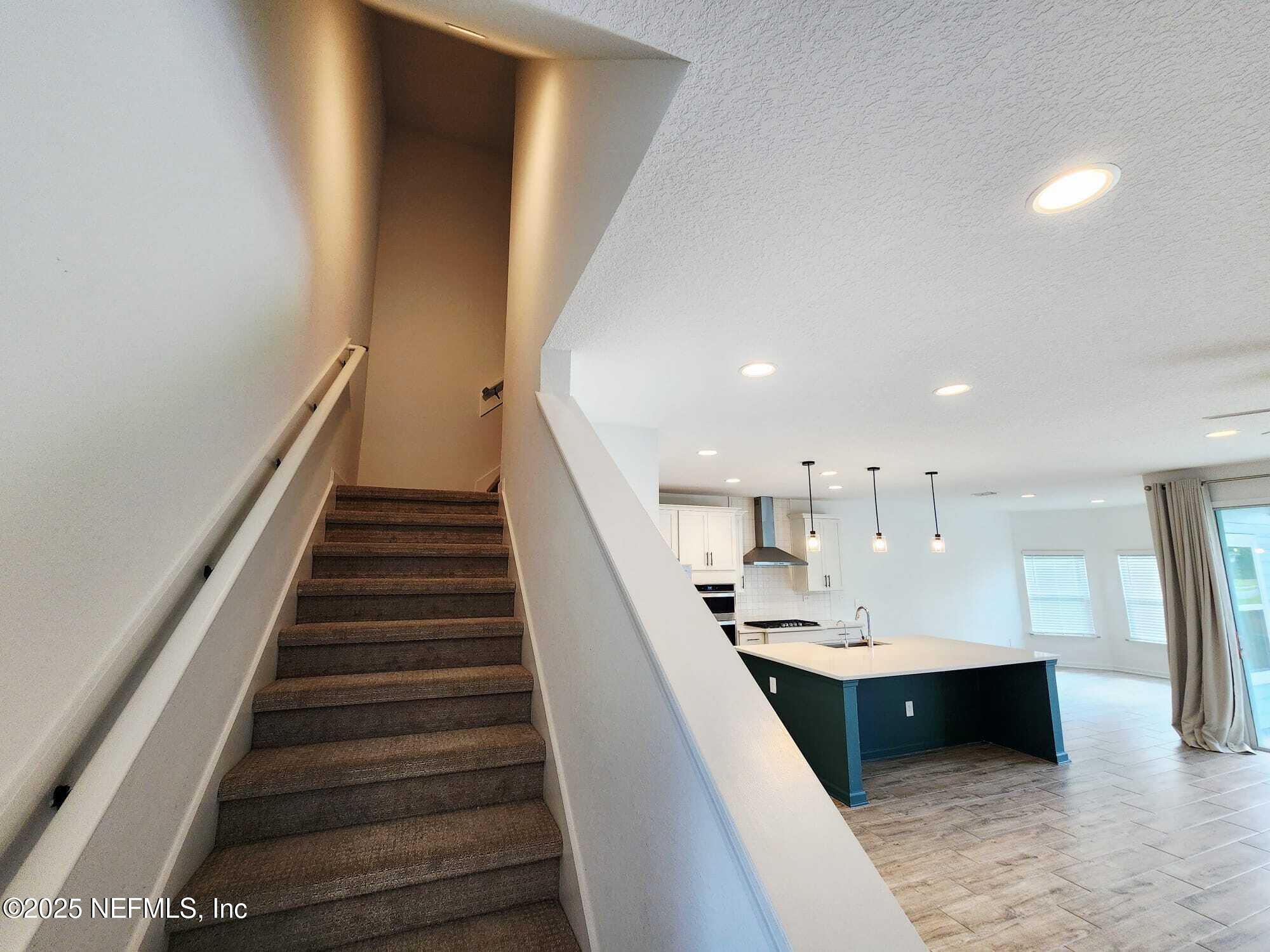 577 Archstone Way St. Augustine, FL 32092 - Photo 24 of 45 a view of kitchen with wooden floor and electronic appliances