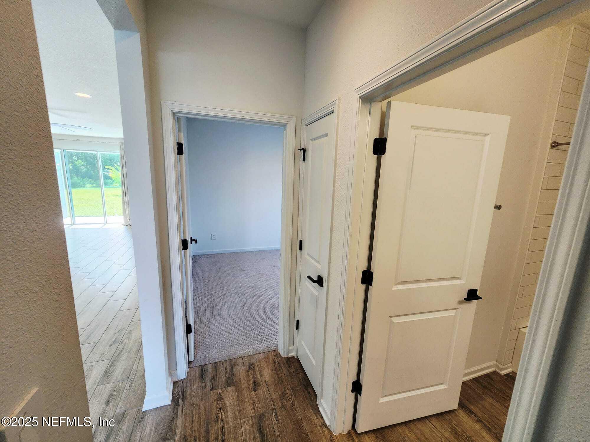 577 Archstone Way St. Augustine, FL 32092 - Photo 26 of 45 a view of a hallway with wooden floor and closet area