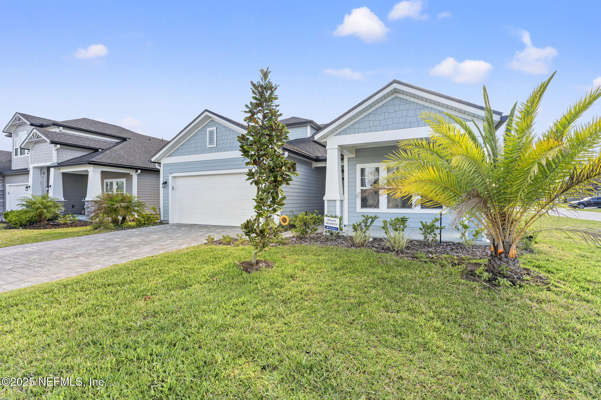 577 Archstone Way St. Augustine, FL 32092 - Photo 3 of 45 a front view of a house with a yard and garage
