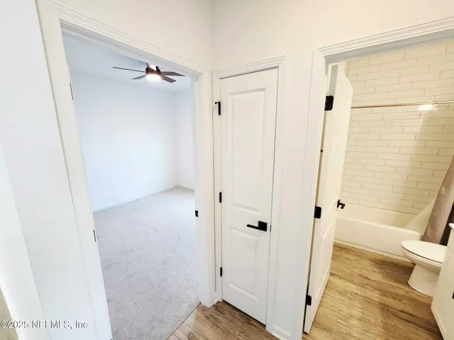 a bathroom with a double vanity sink and mirror