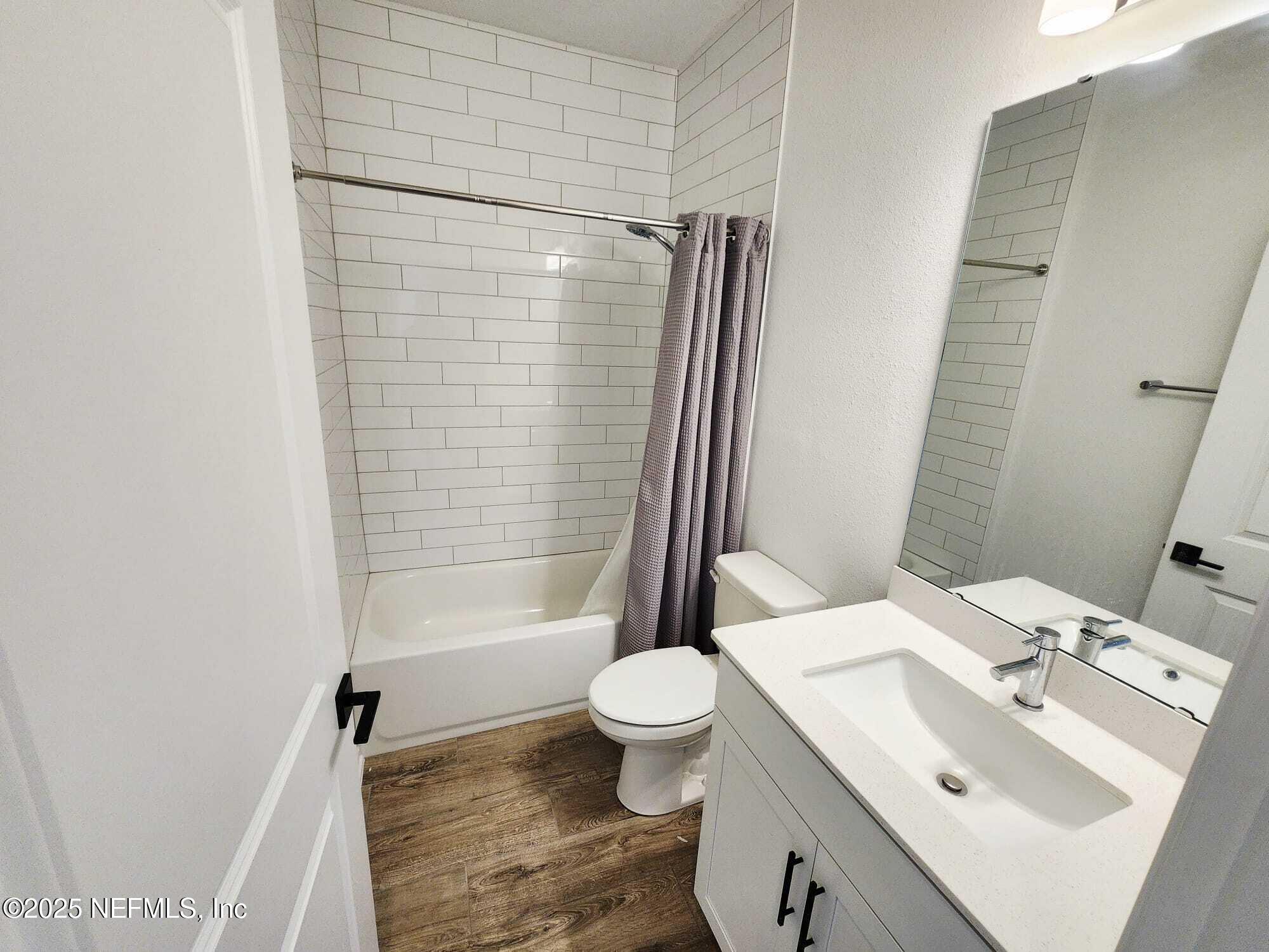 577 Archstone Way St. Augustine, FL 32092 - Photo 32 of 45 a bathroom with a sink toilet and shower