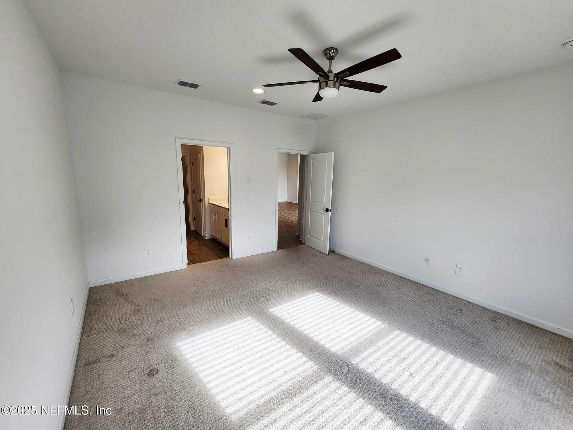577 Archstone Way St. Augustine, FL 32092 - Photo 37 of 45 a view of a big room with wooden floor and windows