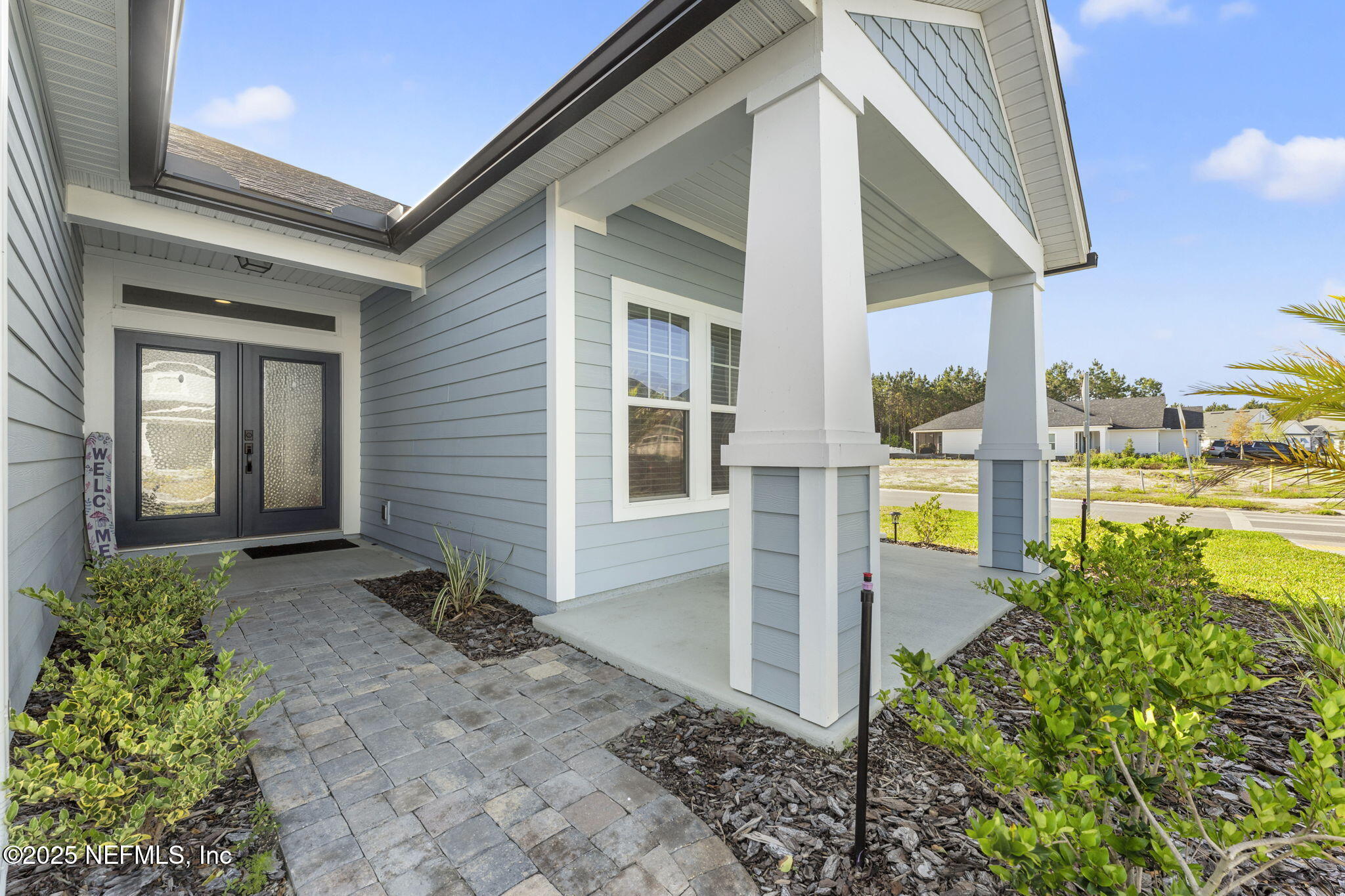 577 Archstone Way St. Augustine, FL 32092 - Photo 4 of 45 a front view of a house with a yard