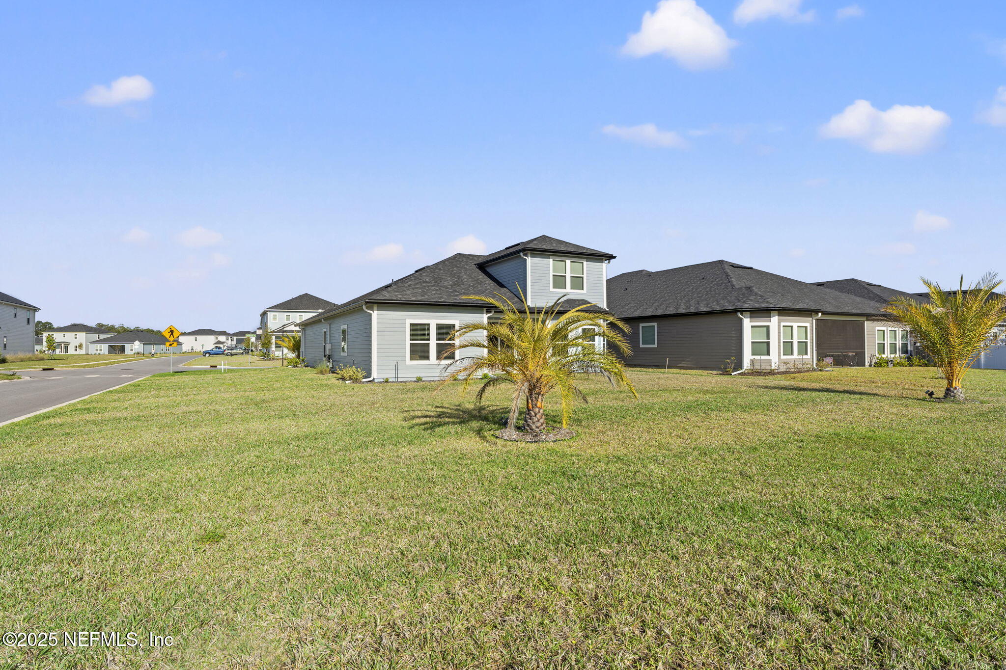 577 Archstone Way St. Augustine, FL 32092 - Photo 45 of 45 a front view of a house with a yard