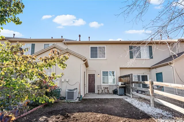 a view of a terrace with chairs and barbeque oven