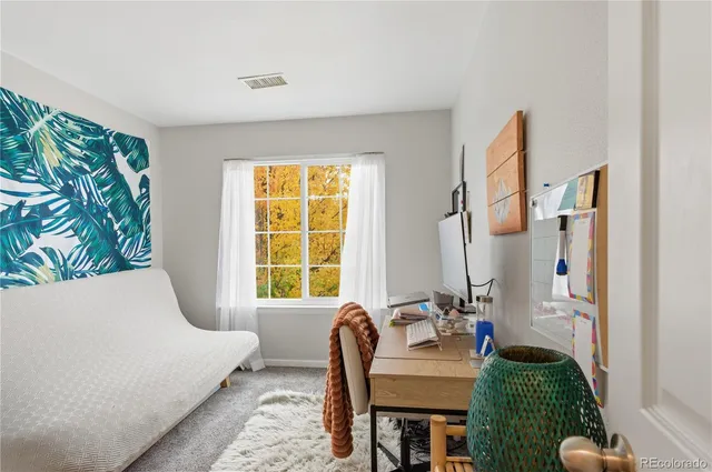 a bedroom with furniture and a window