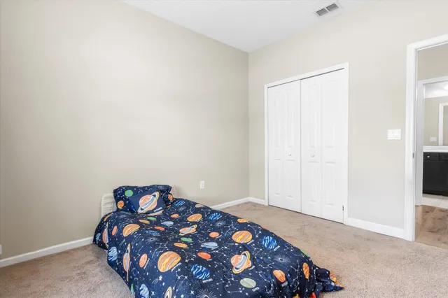 a bedroom with a bed and a tv in it