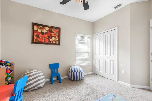 a bedroom with furniture and a window