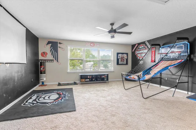 a view of a livingroom with furniture and windows