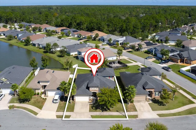 a view of a swimming pool with outdoor seating and plants
