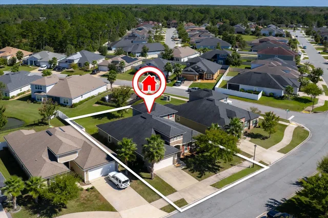 an aerial view of residential house with outdoor space