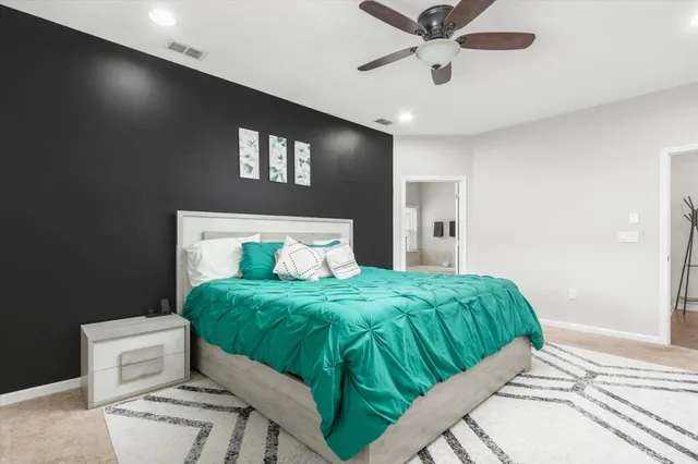 a bedroom with a bed and window