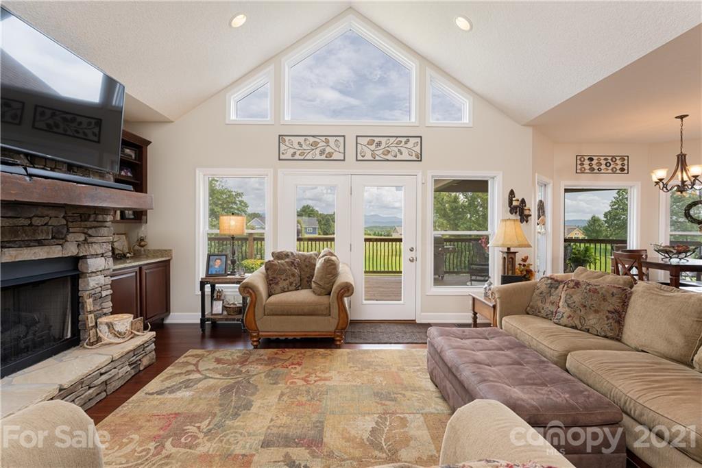 12 Horizon View Lane Alexander, NC 28701 - Photo 14 of 36 a living room with furniture a flat screen tv and a fireplace