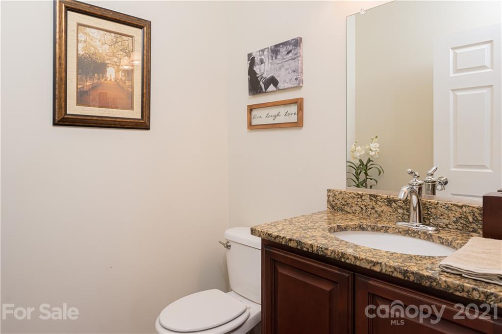 12 Horizon View Lane Alexander, NC 28701 - Photo 16 of 36 a bathroom with a granite countertop toilet sink and mirror