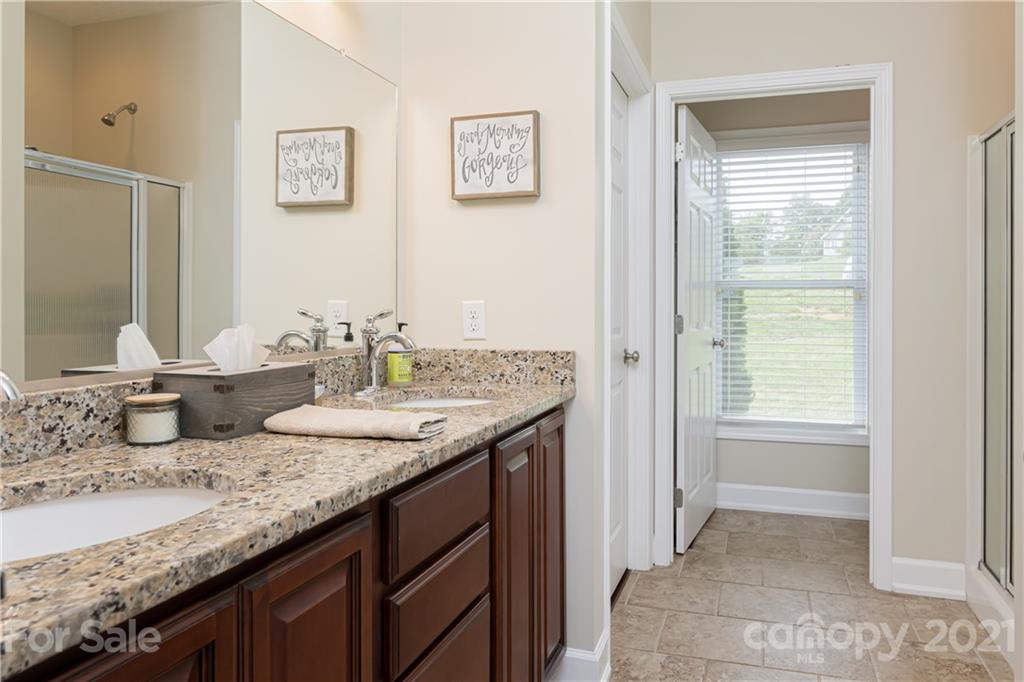 12 Horizon View Lane Alexander, NC 28701 - Photo 18 of 36 a bathroom with a granite countertop sink and a mirror