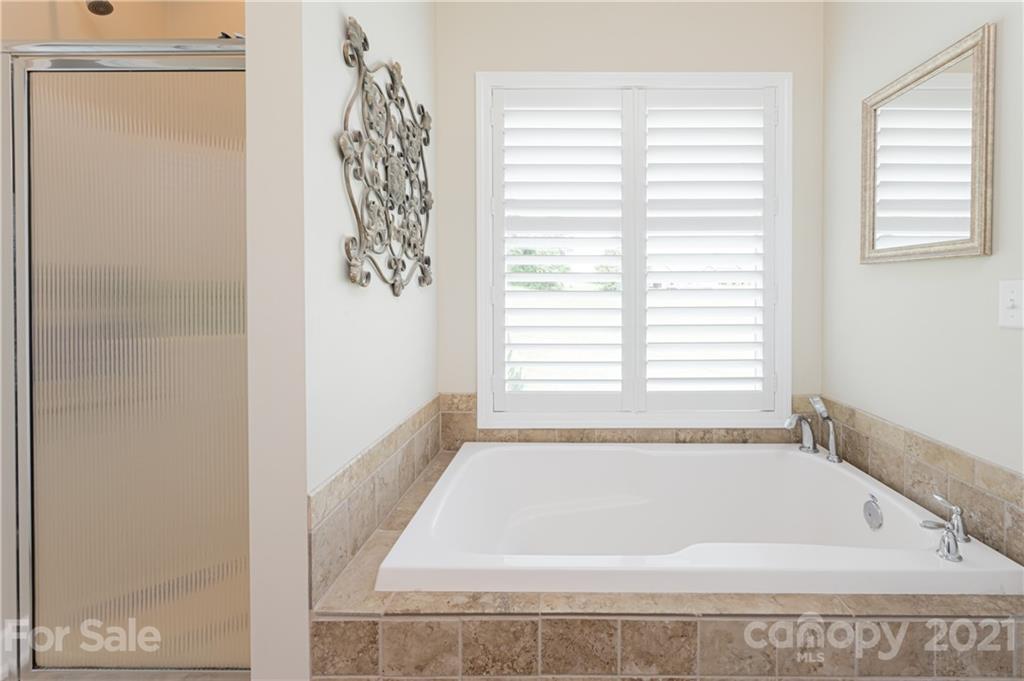 12 Horizon View Lane Alexander, NC 28701 - Photo 19 of 36 a bath tub sitting in a bathroom next to a window