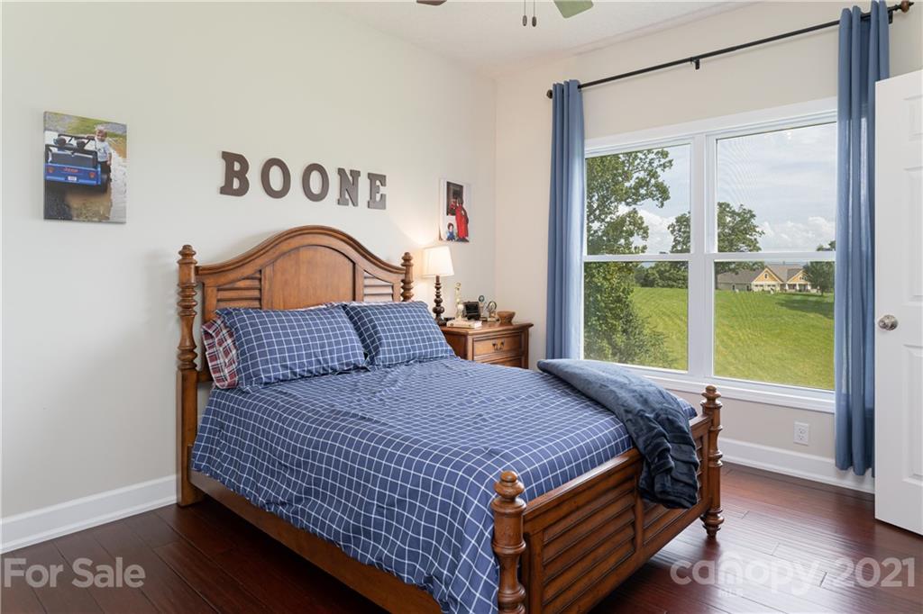 12 Horizon View Lane Alexander, NC 28701 - Photo 20 of 36 a bedroom with a bed and a large window