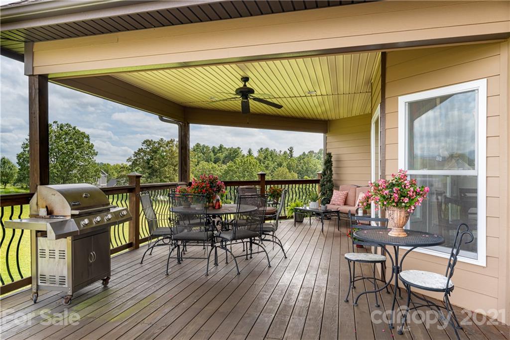 12 Horizon View Lane Alexander, NC 28701 - Photo 26 of 36 a view of a balcony with chairs and wooden floor