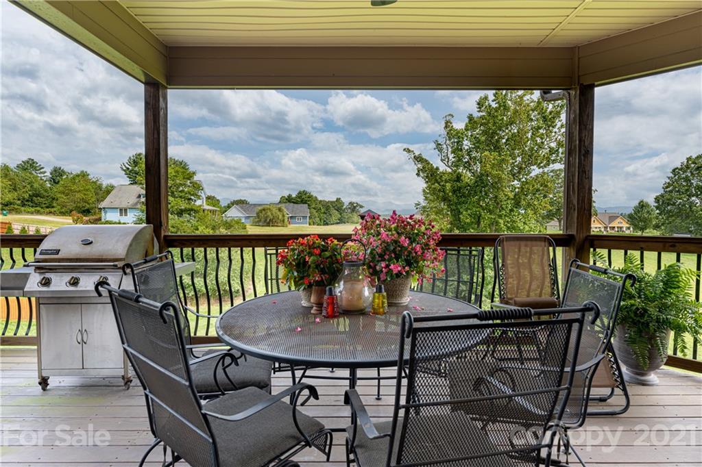12 Horizon View Lane Alexander, NC 28701 - Photo 28 of 36 a view of a balcony with table and chairs