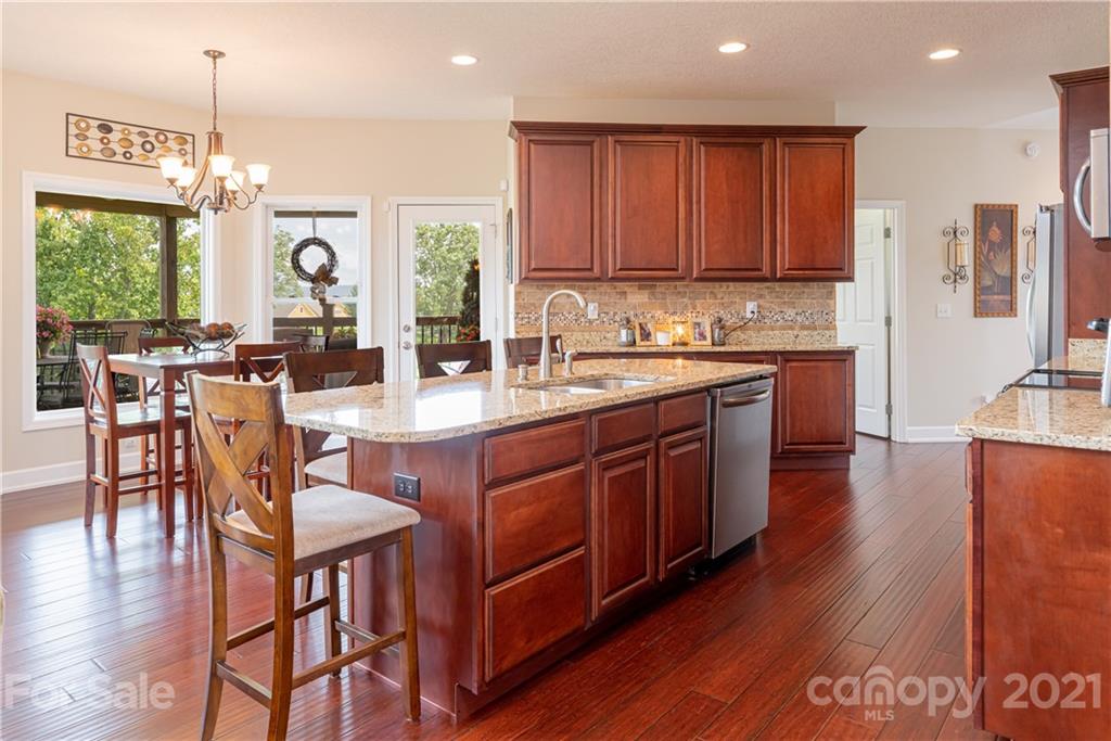 12 Horizon View Lane Alexander, NC 28701 - Photo 8 of 36 a large kitchen with lots of counter space a sink and chairs