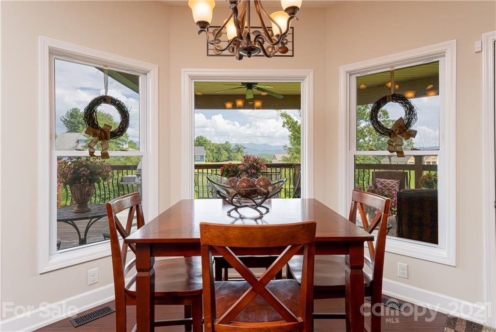 12 Horizon View Lane Alexander, NC 28701 - Photo 10 of 36 a dining room with furniture a window and a chandelier