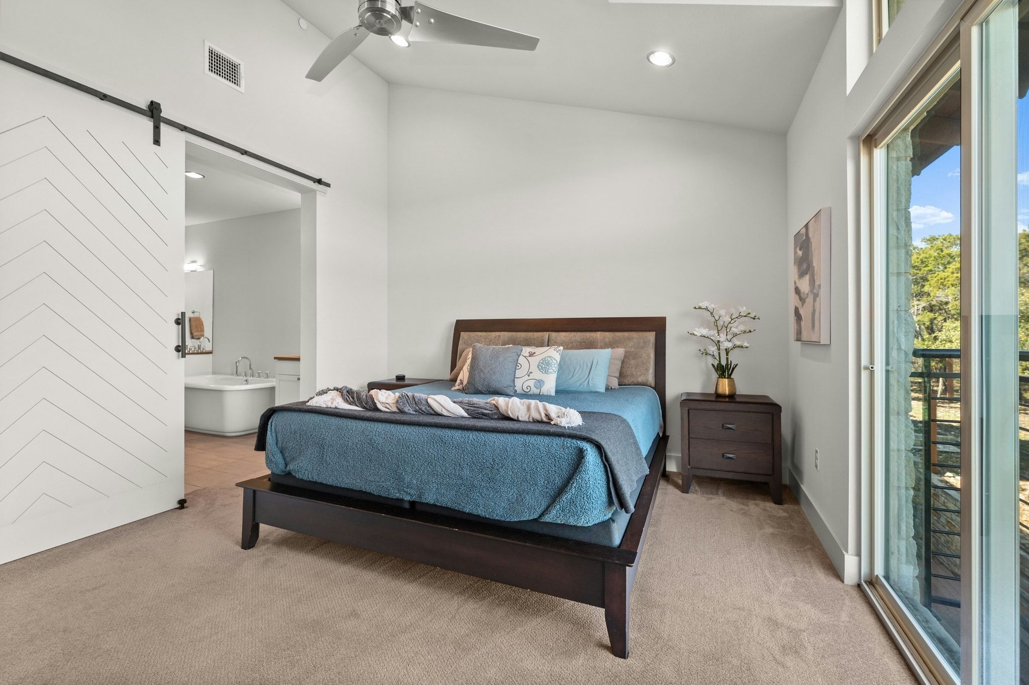 8110 Ranch Road 2222, Unit 92 Austin, TX 78730 - Photo 15 of 40 Vaulted ceiling bedroom featuring a ceiling fan, recessed lighting, and direct access to an outdoor balcony