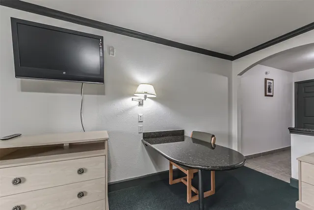a kitchen with a sink stainless steel appliances and cabinets