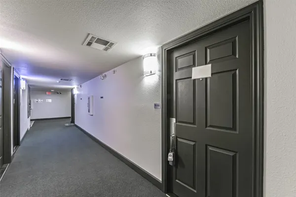a view of a hallway with closet area