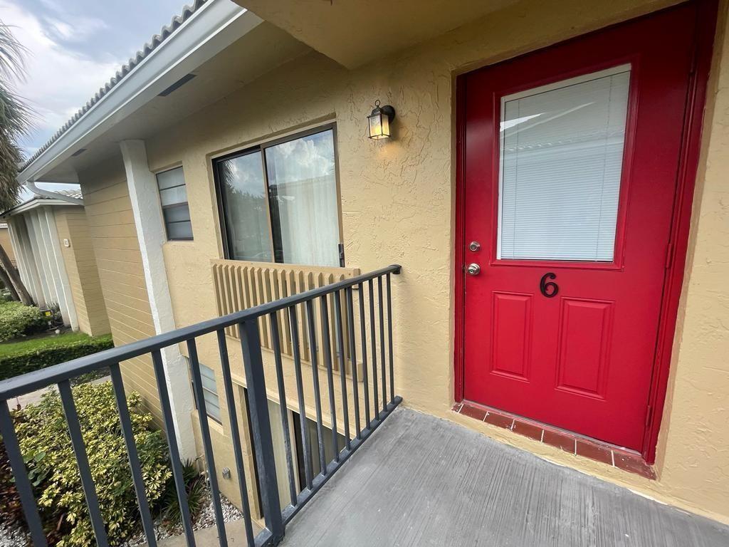 a view of a red door and an entrance door