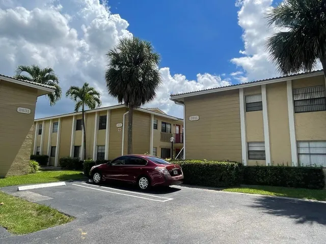 a car parked in front of a house