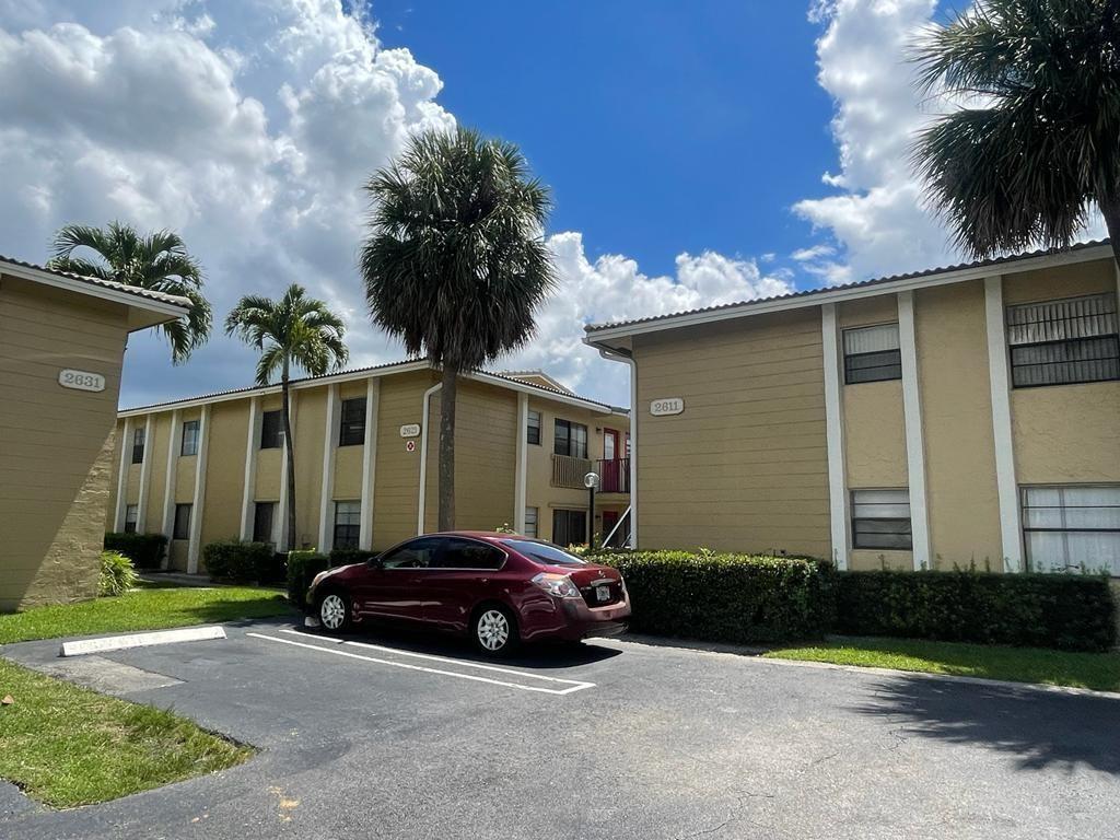 2621 Riverside Drive, Unit 6 Coral Springs, FL 33065 - Photo 15 of 20 a car parked in front of a house