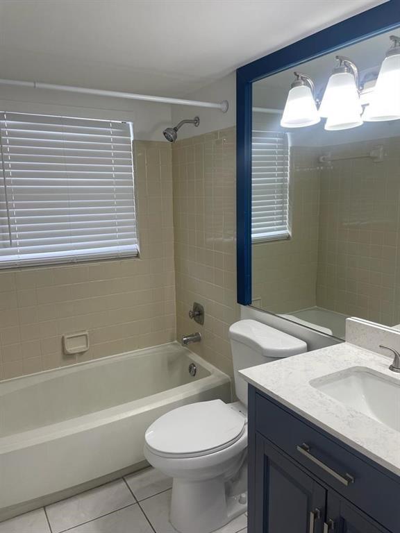 2621 Riverside Drive, Unit 6 Coral Springs, FL 33065 - Photo 6 of 20 a bathroom with a sink a toilet and shower