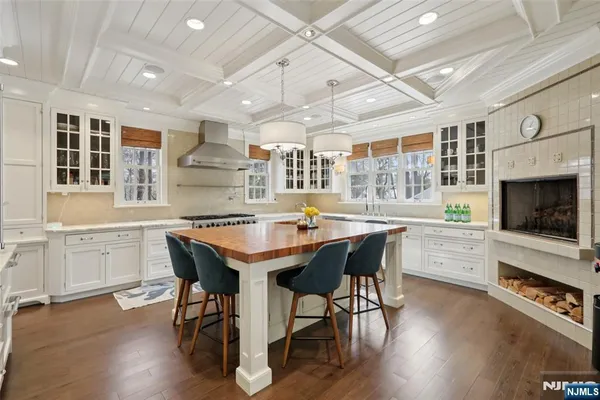 a dining table with chairs and wooden floor