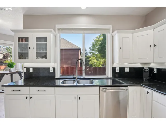 a bedroom with a bed and a night stand