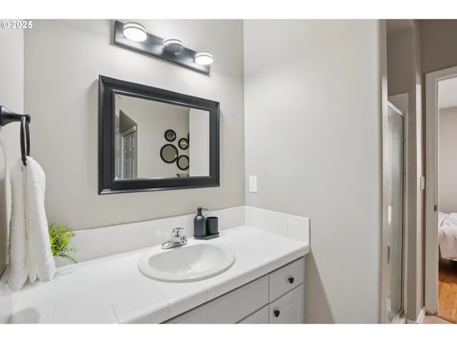 a living room with furniture and a gym machine