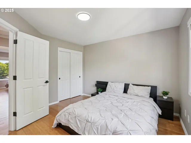 a bedroom with a bed and a table