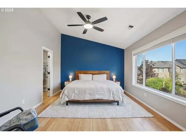 a bathroom with a sink vanity granite tub shower and a mirror