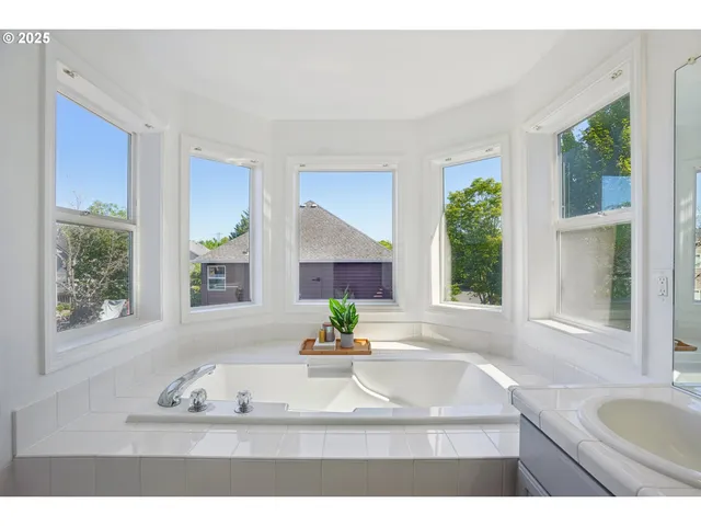 a view of a chairs and tables in the back yard of the house