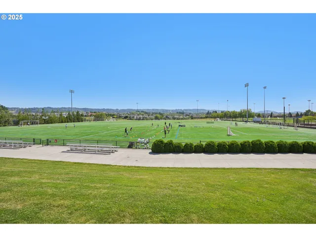 a view of a green field with clear sky