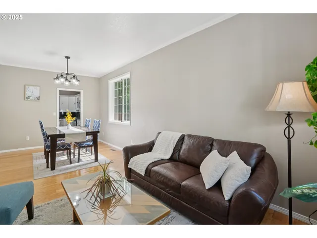 a living room with furniture a window and a fireplace