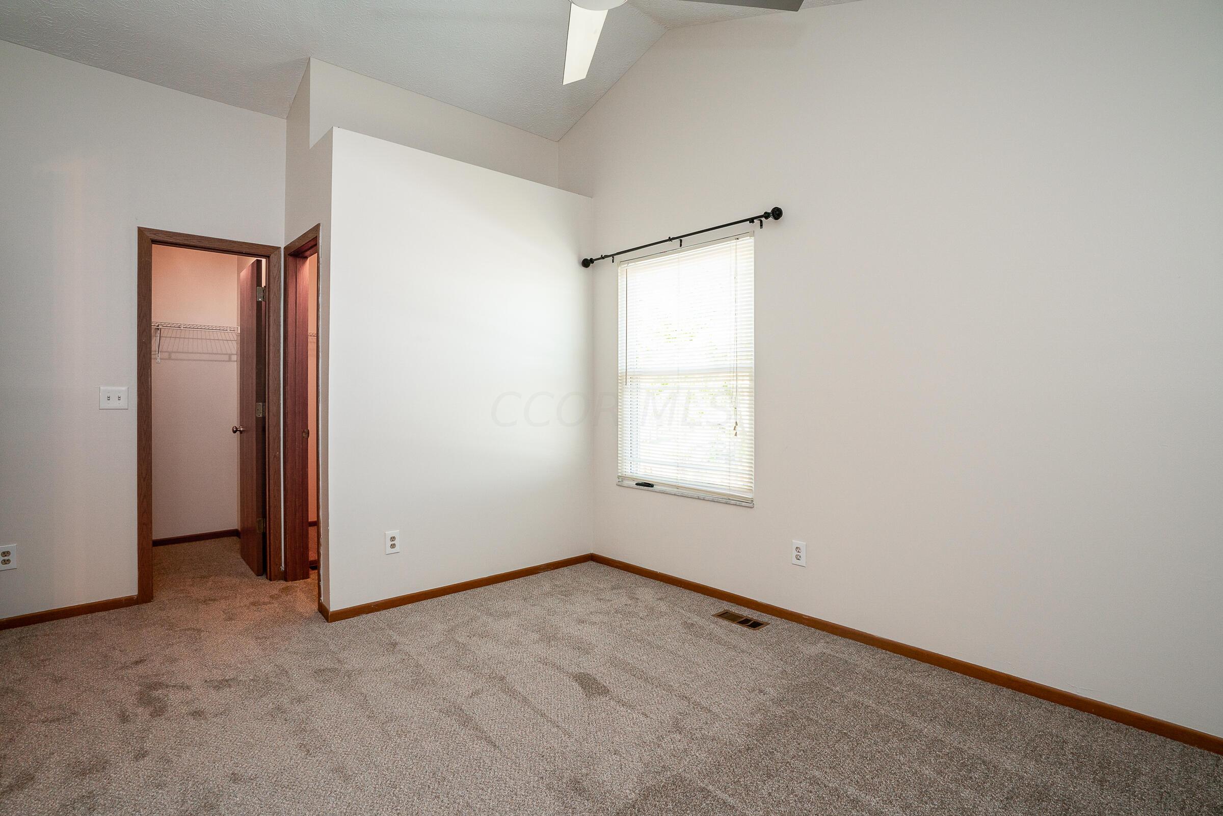 2135 Tonda Lane Grove City, OH 43123 - Photo 18 of 37 Primary bedroom features vaulted ceiling, freshly painted interior and 2 large closets
