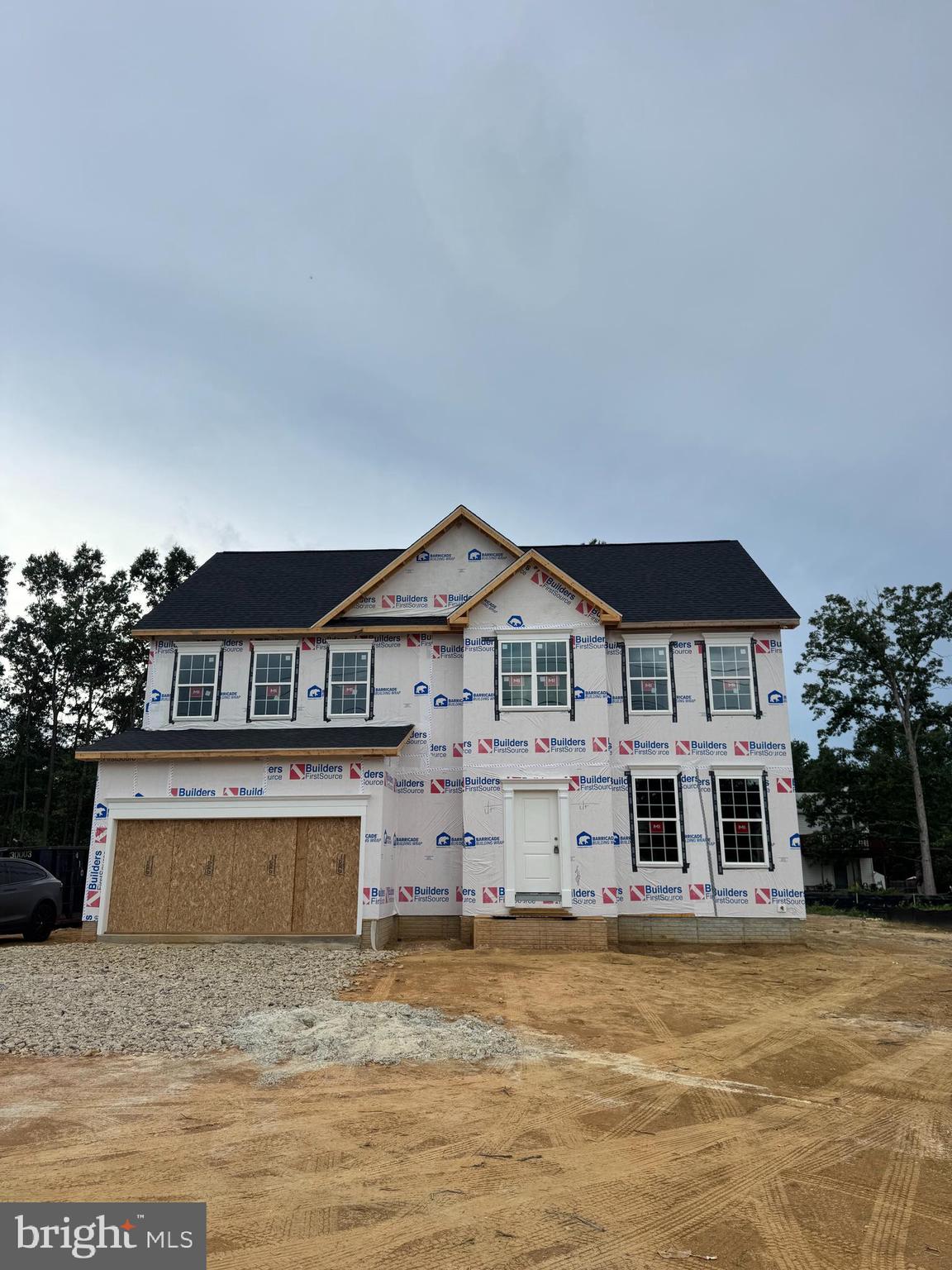 6517 Suitland Road Suitland, MD 20746 - Photo 6 of 10 a front view of a house with a yard